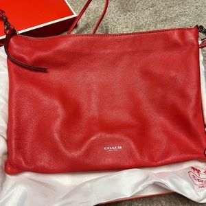 Coach handbag. Beautiful coral color. Leather. Comes with dust bag and box.